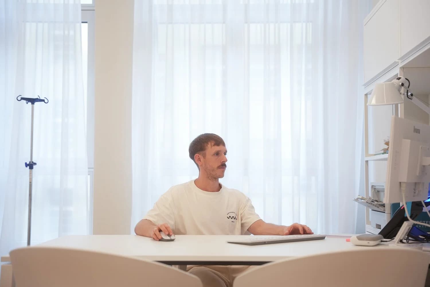 Jan Okoye-Weeg at his desk